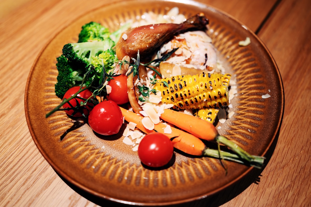 Colorful lunch plate with vegetables and grilled chicken